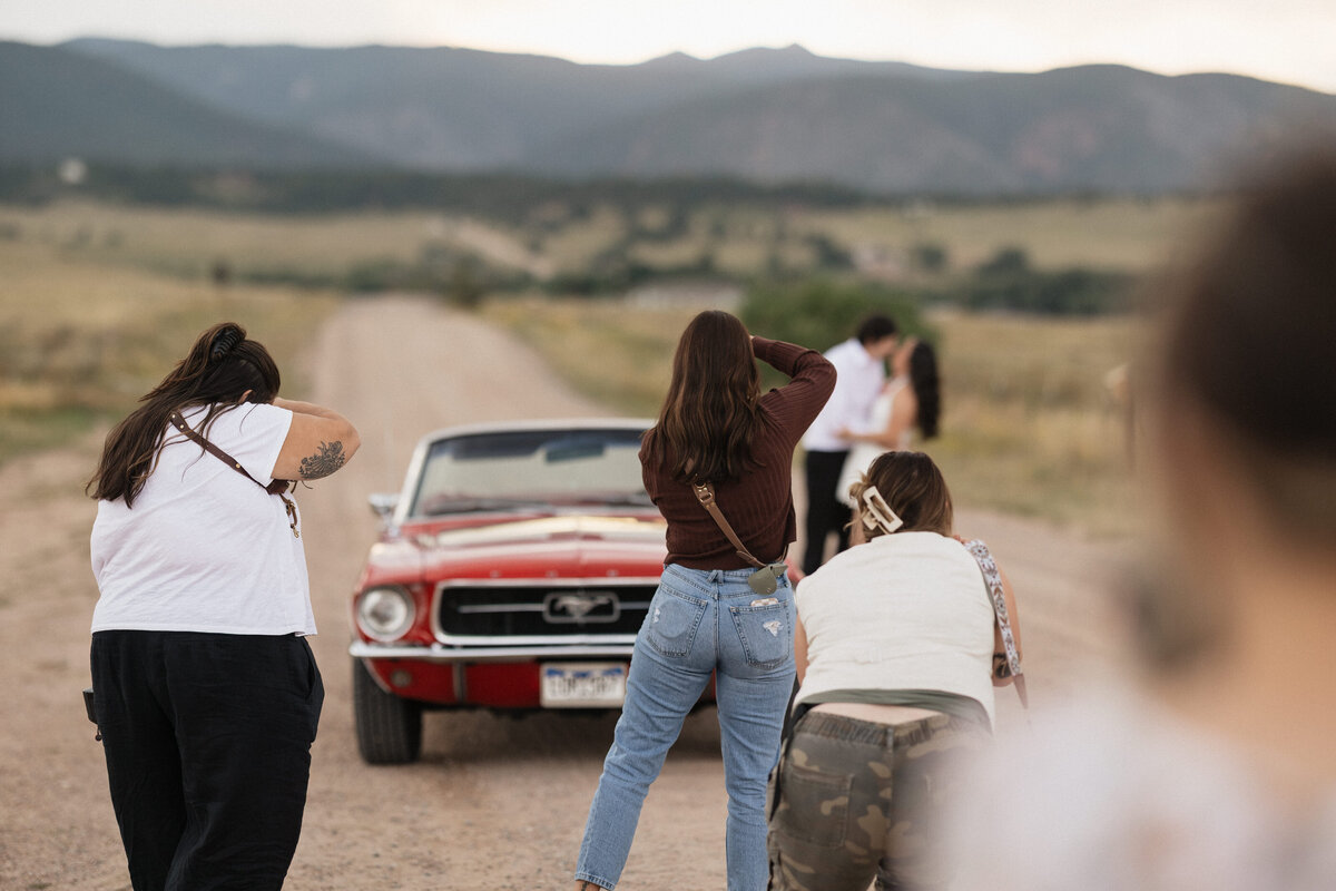 Behind the scenes of a wedding shoot during hands-on learning at the retreat.