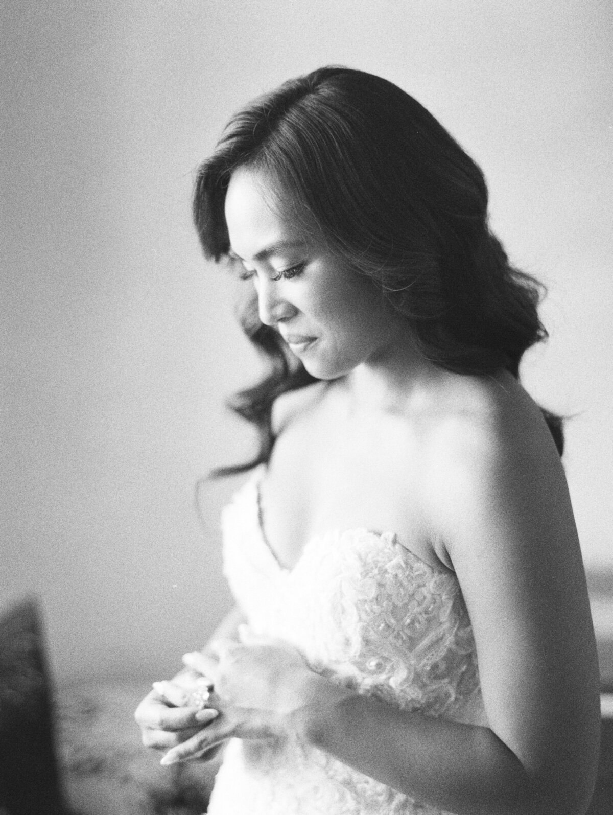 black and white photograph of the bride getting ready for the ceremony