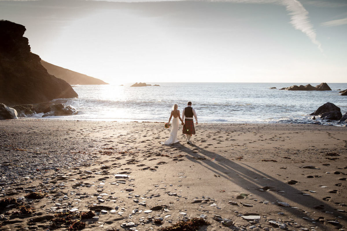 Devon Beach Wedding photo of couple on the beach at Tunnels Beaches