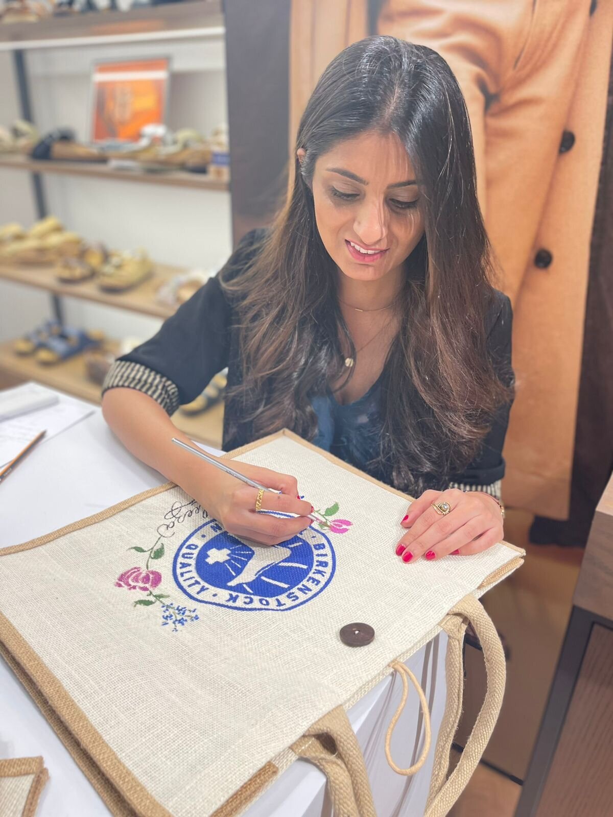artist painting on bags