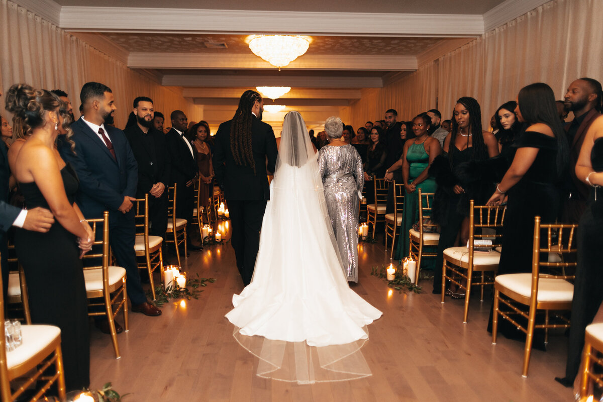 Bride walking down the wedding aisle