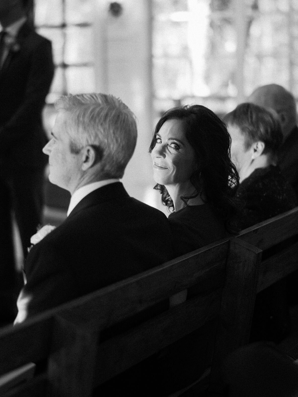 mother of bride smiling during ceremony