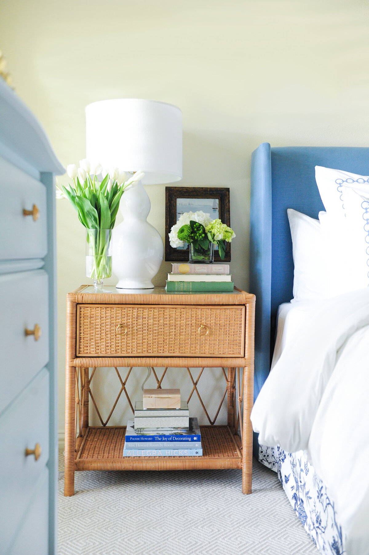 Rattan nightstand with white  lamp and accessories