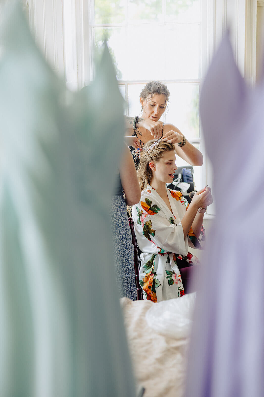 Bride having her hair done at Mansion at Keuka Lake, NY