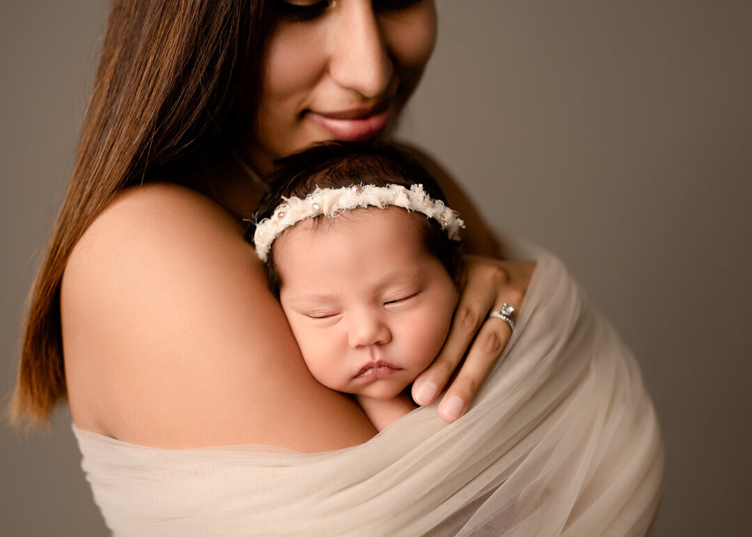 Brighton Newborn Photographer Baby Sleeping Wrapped with Mom by For the Love of Photography