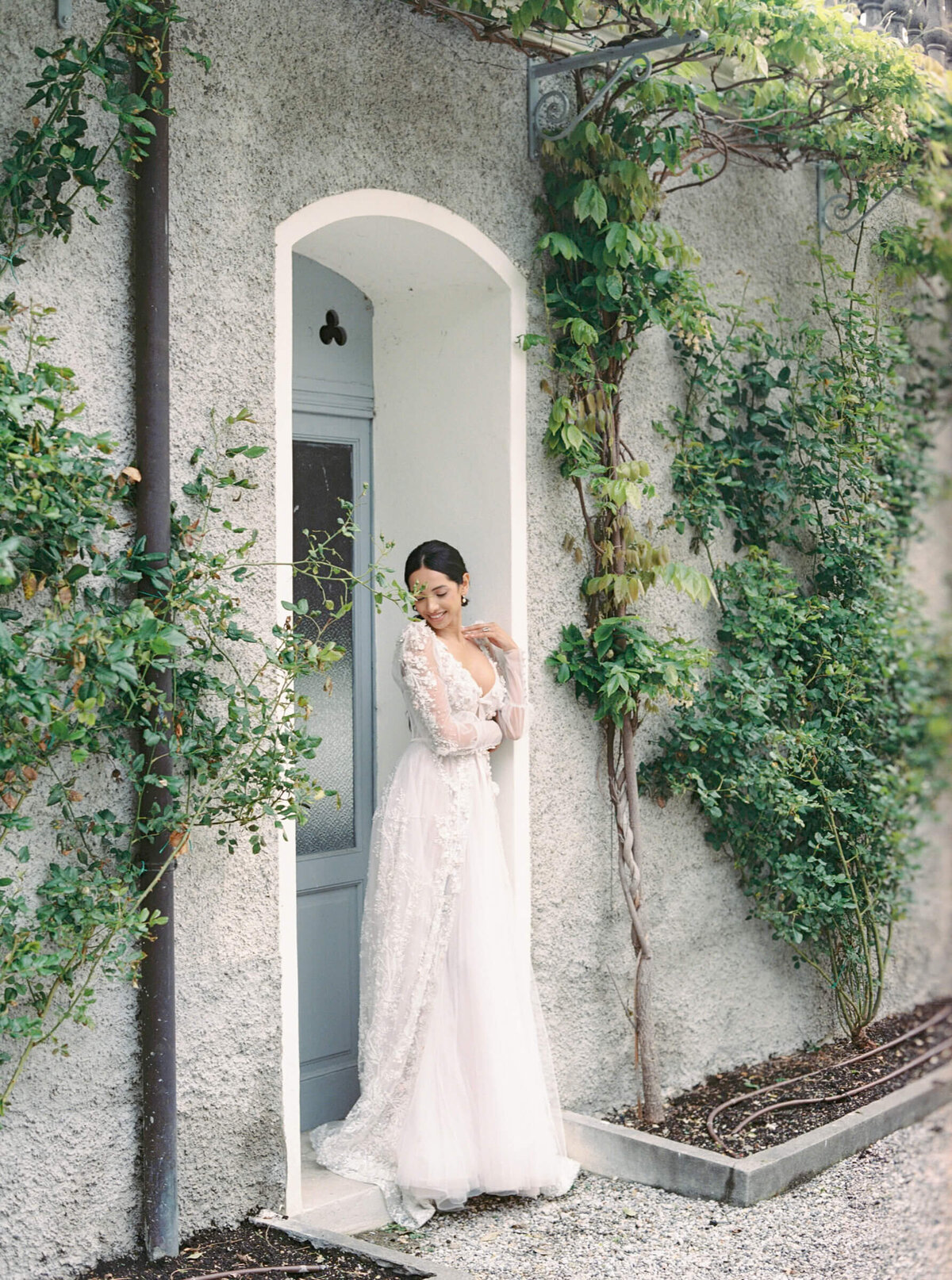 A wedding day bridal shot of a bride in her white dress at Villa Aura del Lago on lake como in Italy