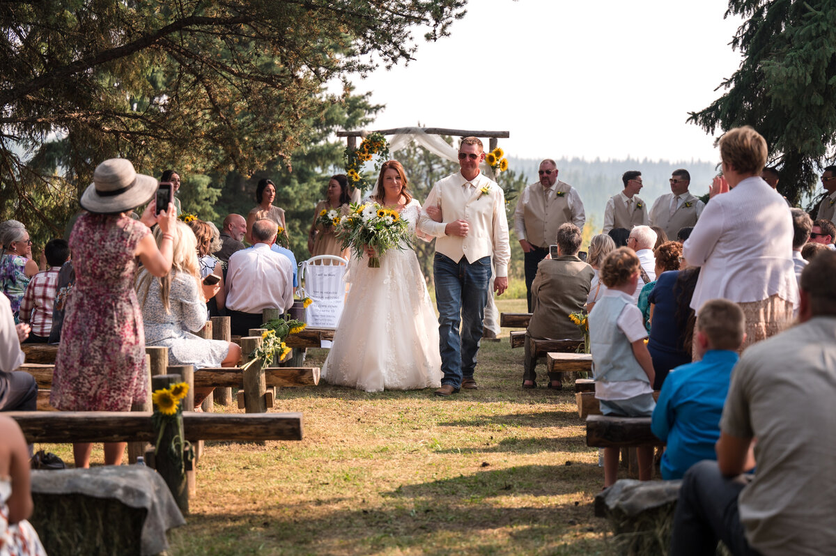 Bride and groom walk down the isle
