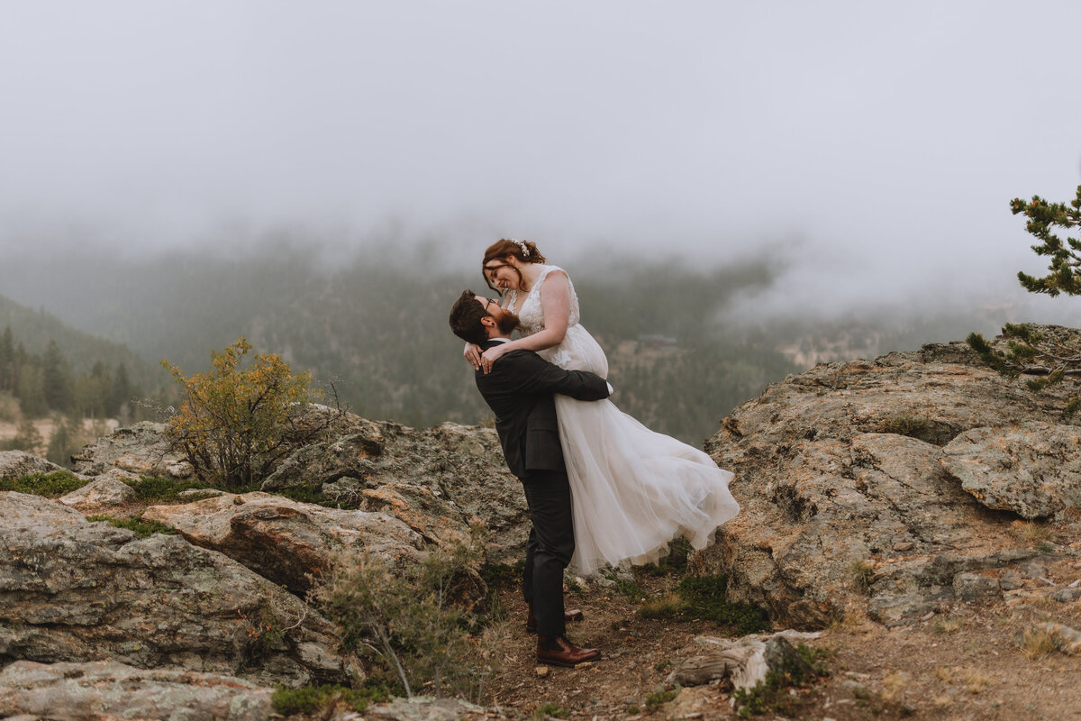 groom lifting bride up