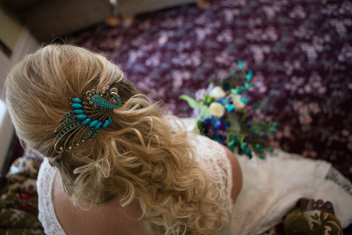 blonde curled hair with hair piece for wedding