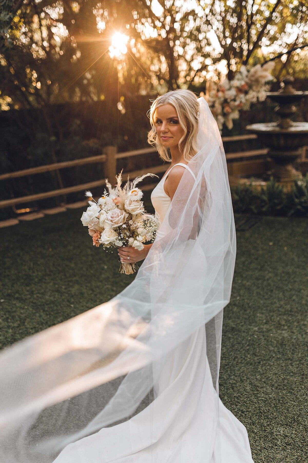 Bride backlit by the sunset