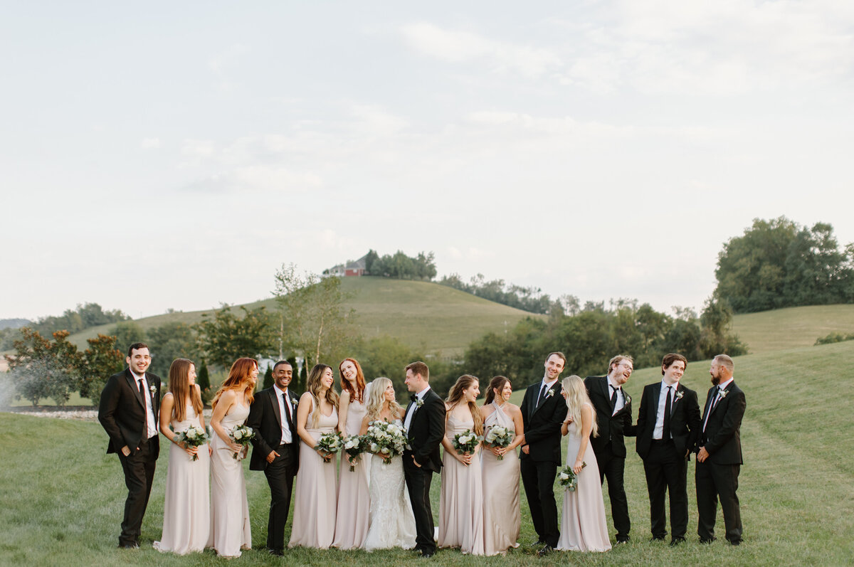 Bride and Groom with their full wedding party at White Dove Barn