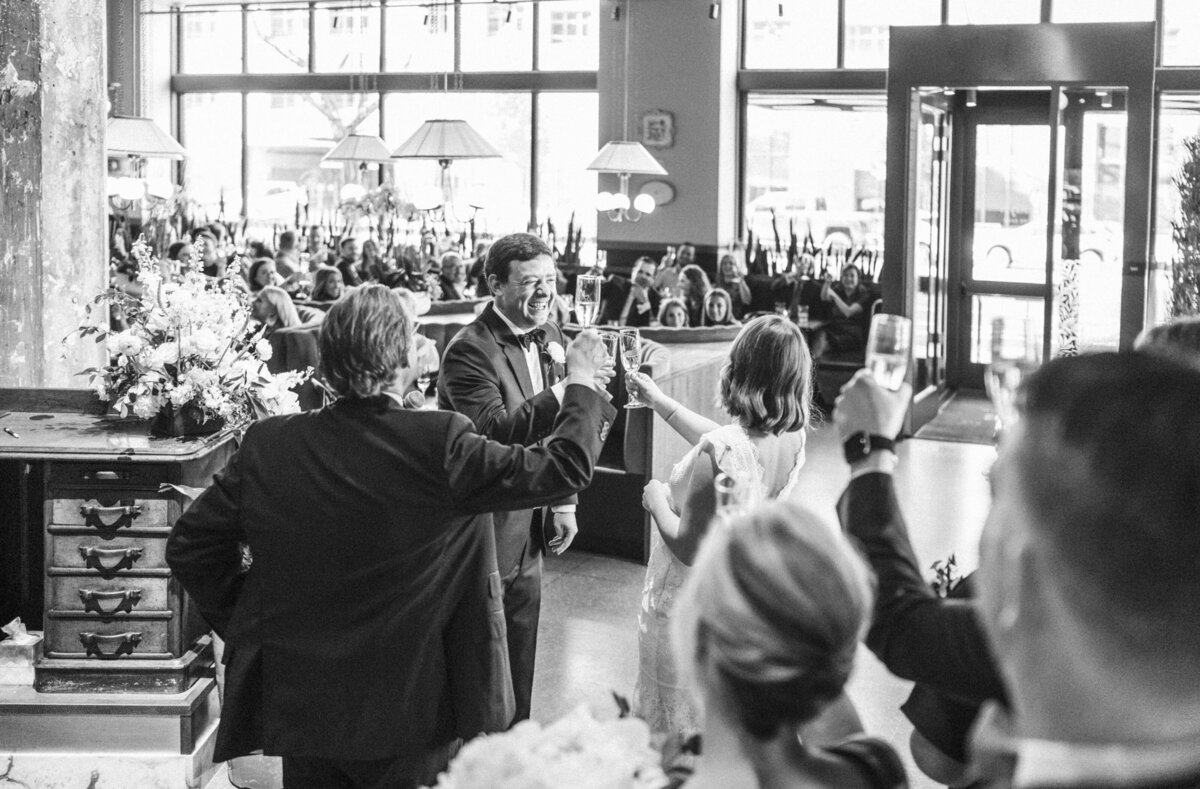 couple-gives-cheers-in-front-of-all-of-their-guests