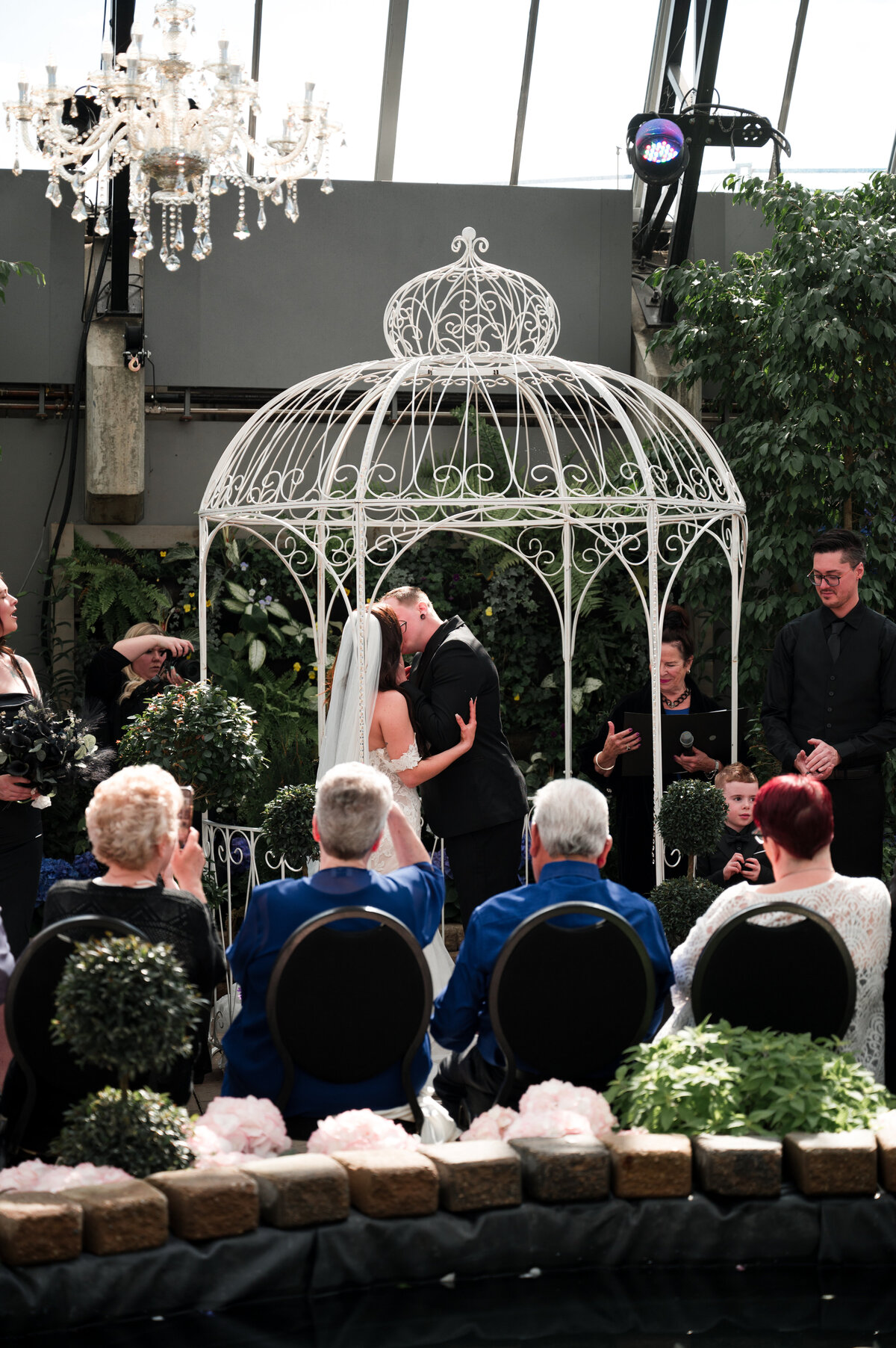 bride and grooms first kiss on wedding day
