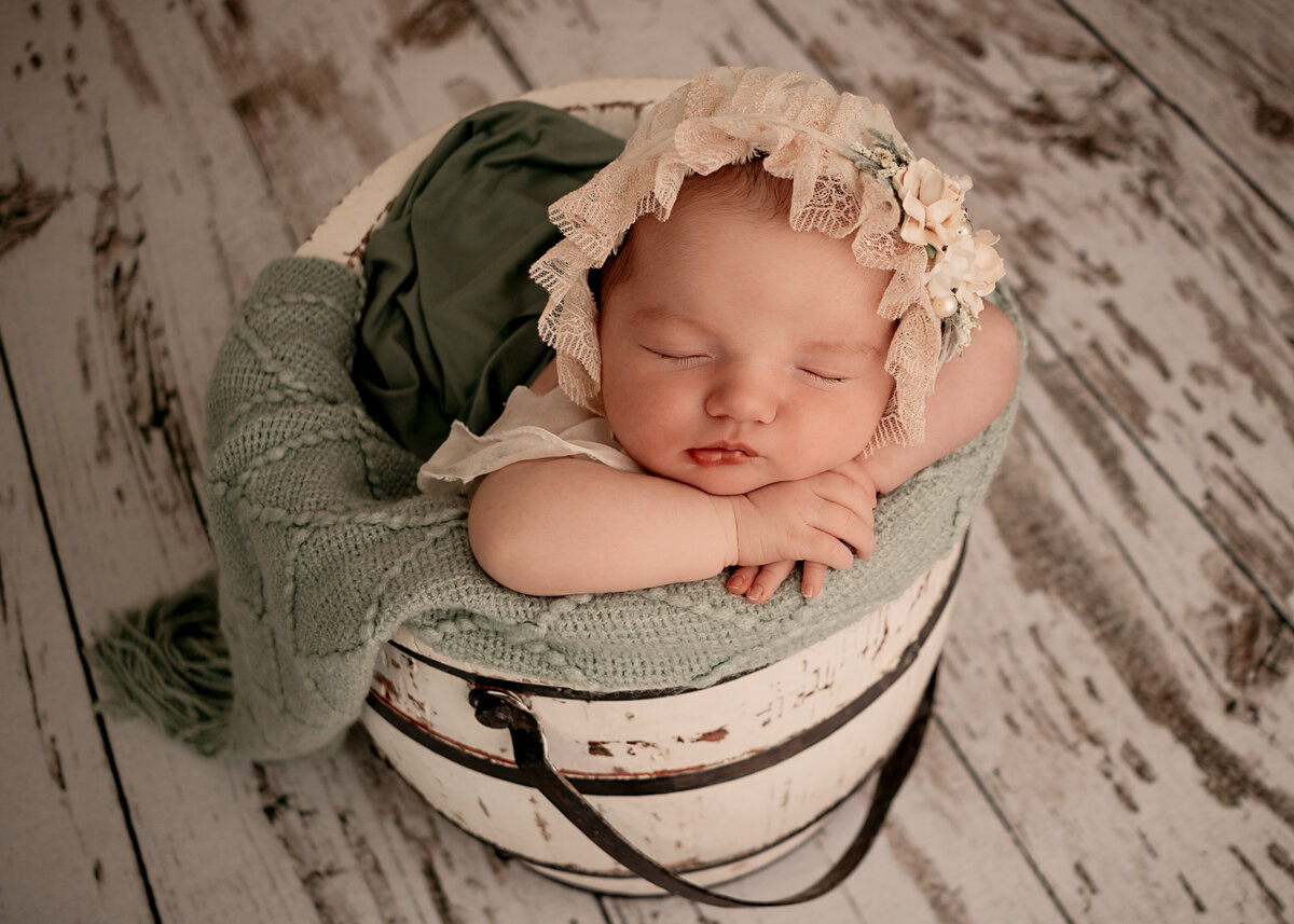 Newborn girl with bonnet