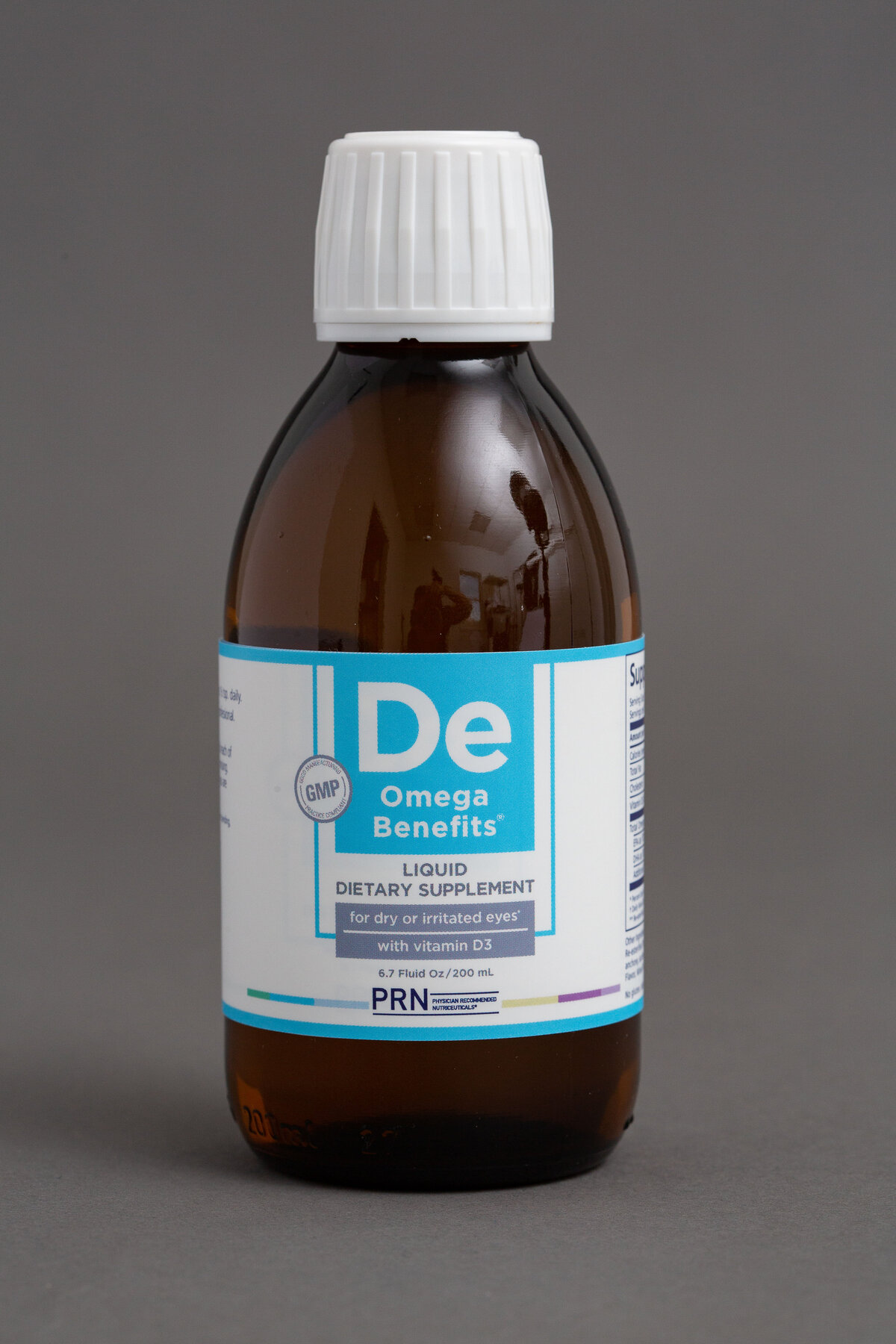 Brown glass bottle with De  on the lable