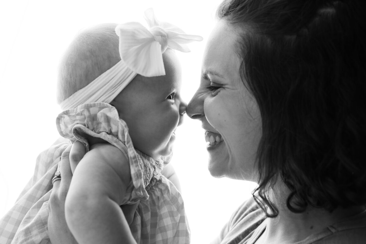 Mom and daughter backlit black and white