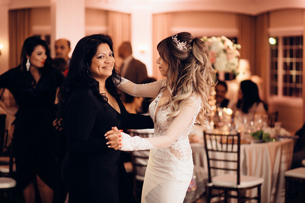 Wedding Photograph Of Bride Dancing With a Woman In Black Dress Los Angeles