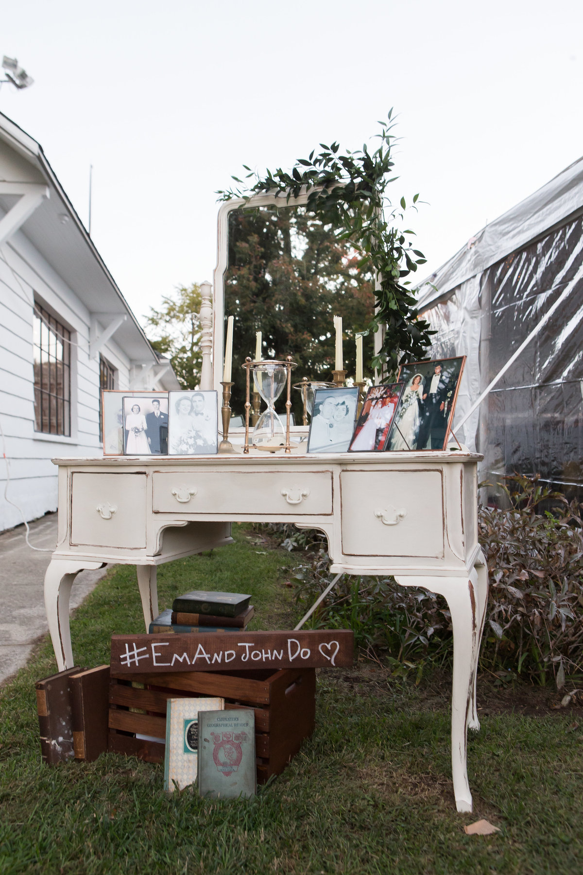 Antique desk as welcome table at outdoor wedding