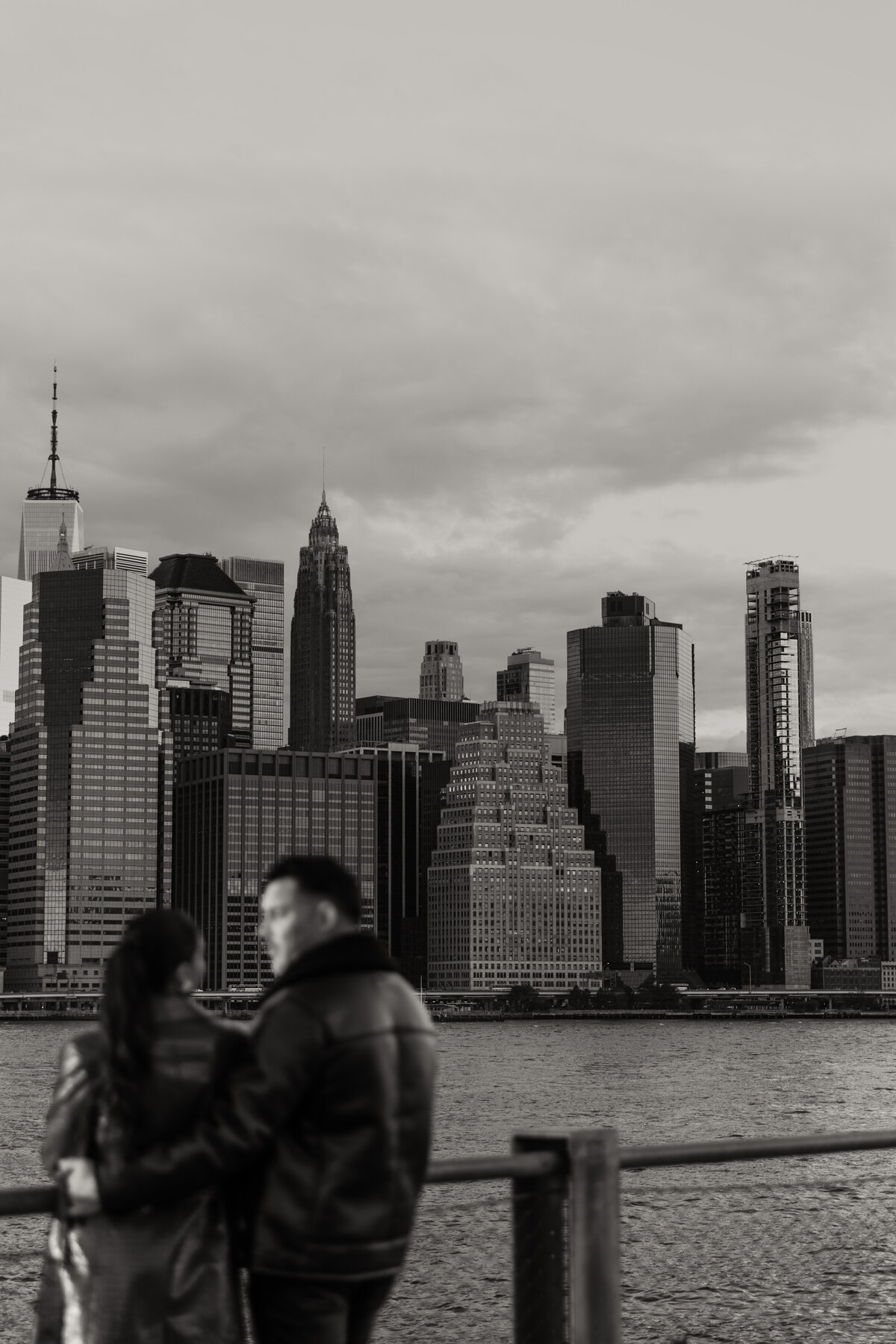 New York City Engagement Photo of the Couple Looking out at the City View 