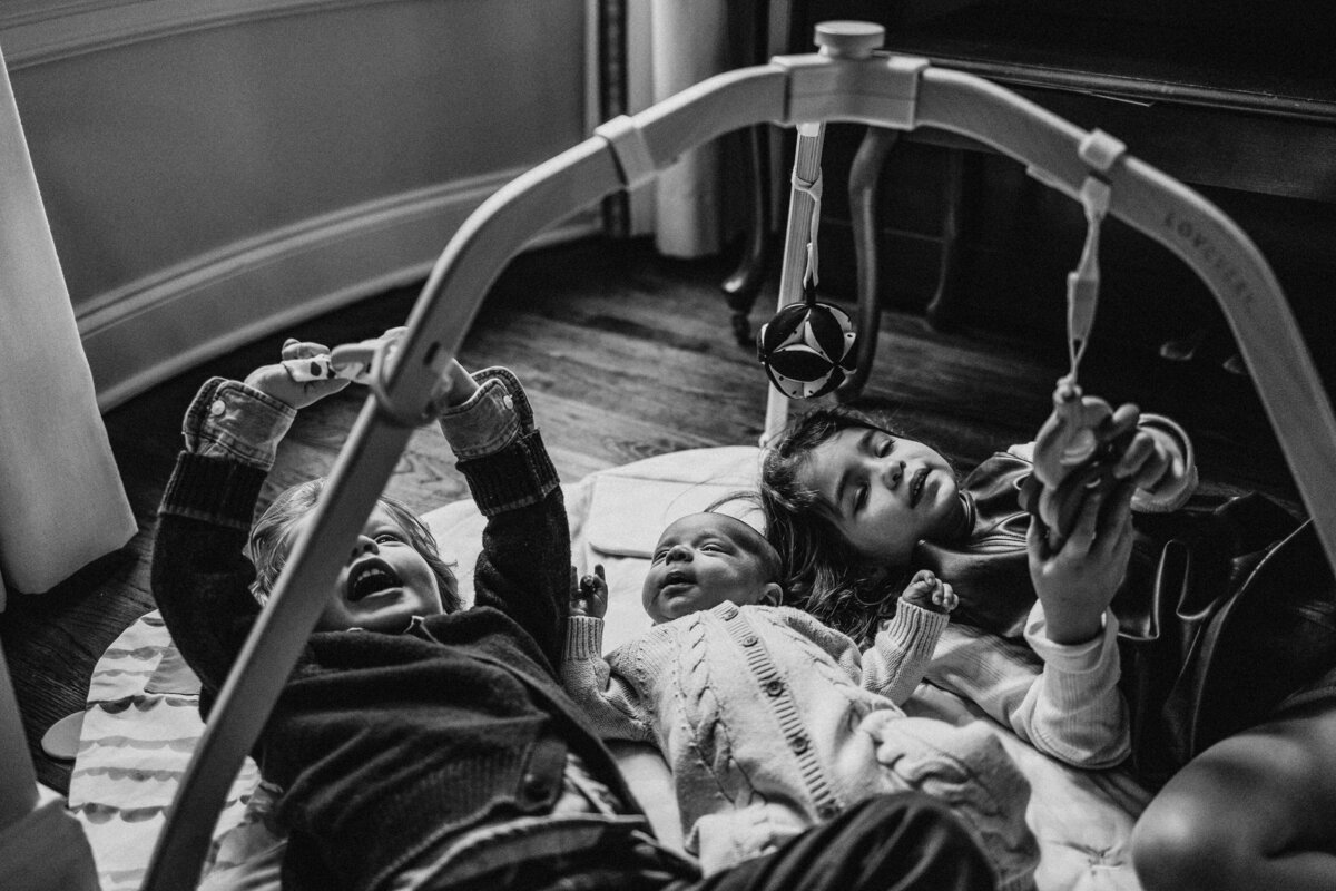 lifestyle imagery family with new baby in home