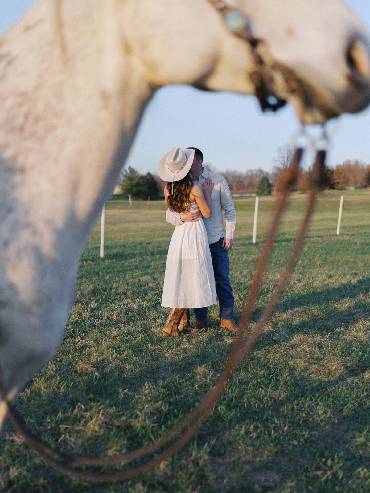 engaged-couple-kissing-farm
