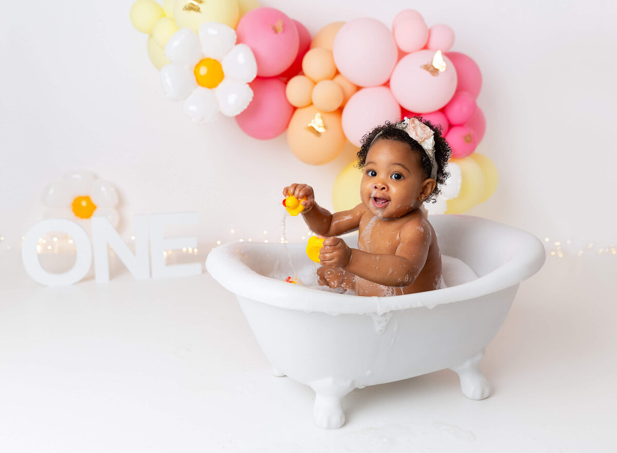 Bubble bath daisy theme for baby girl captured by NYC baby photographer 