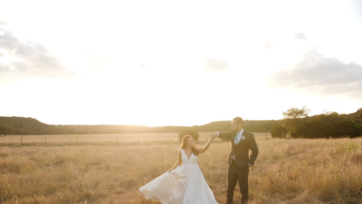 Husband and wife elope together at golden hour in a field