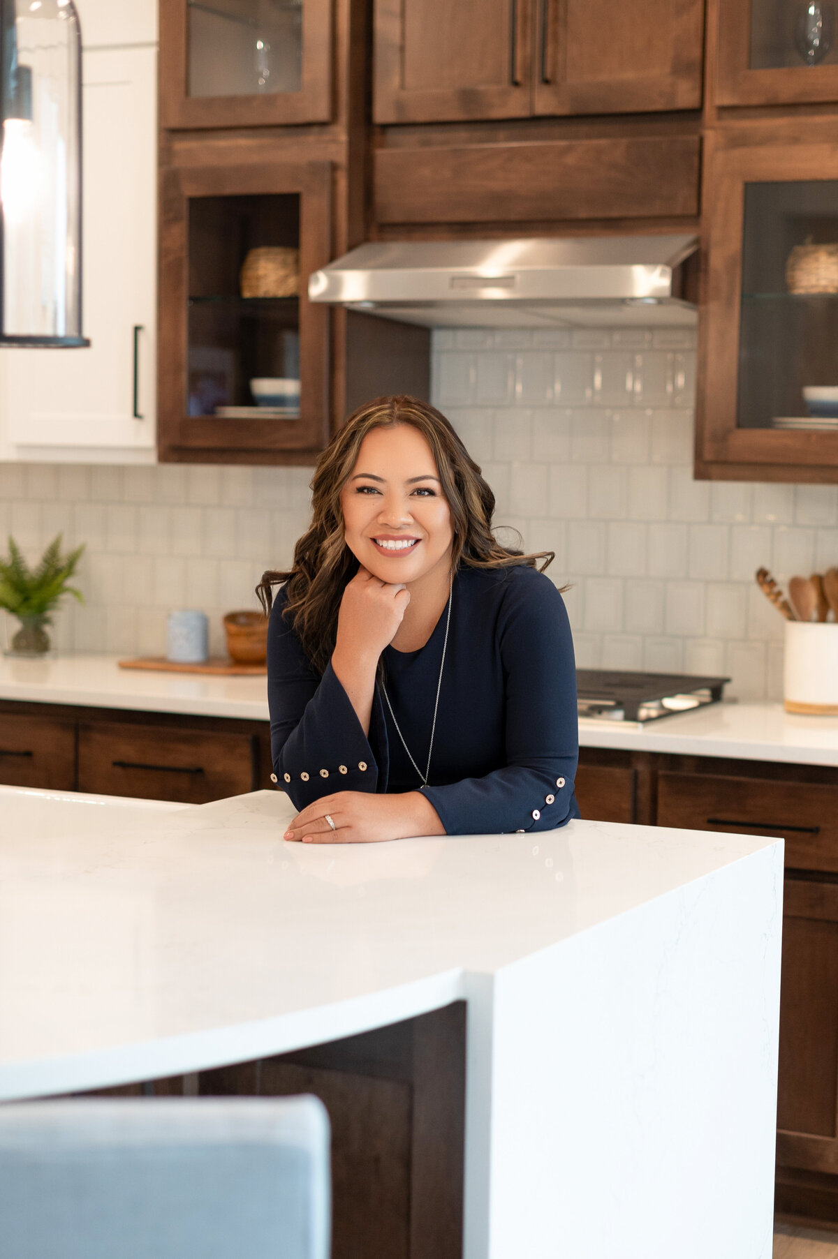 Professional portrait of Marilly Mendez in kitchen, captured by Lissette G