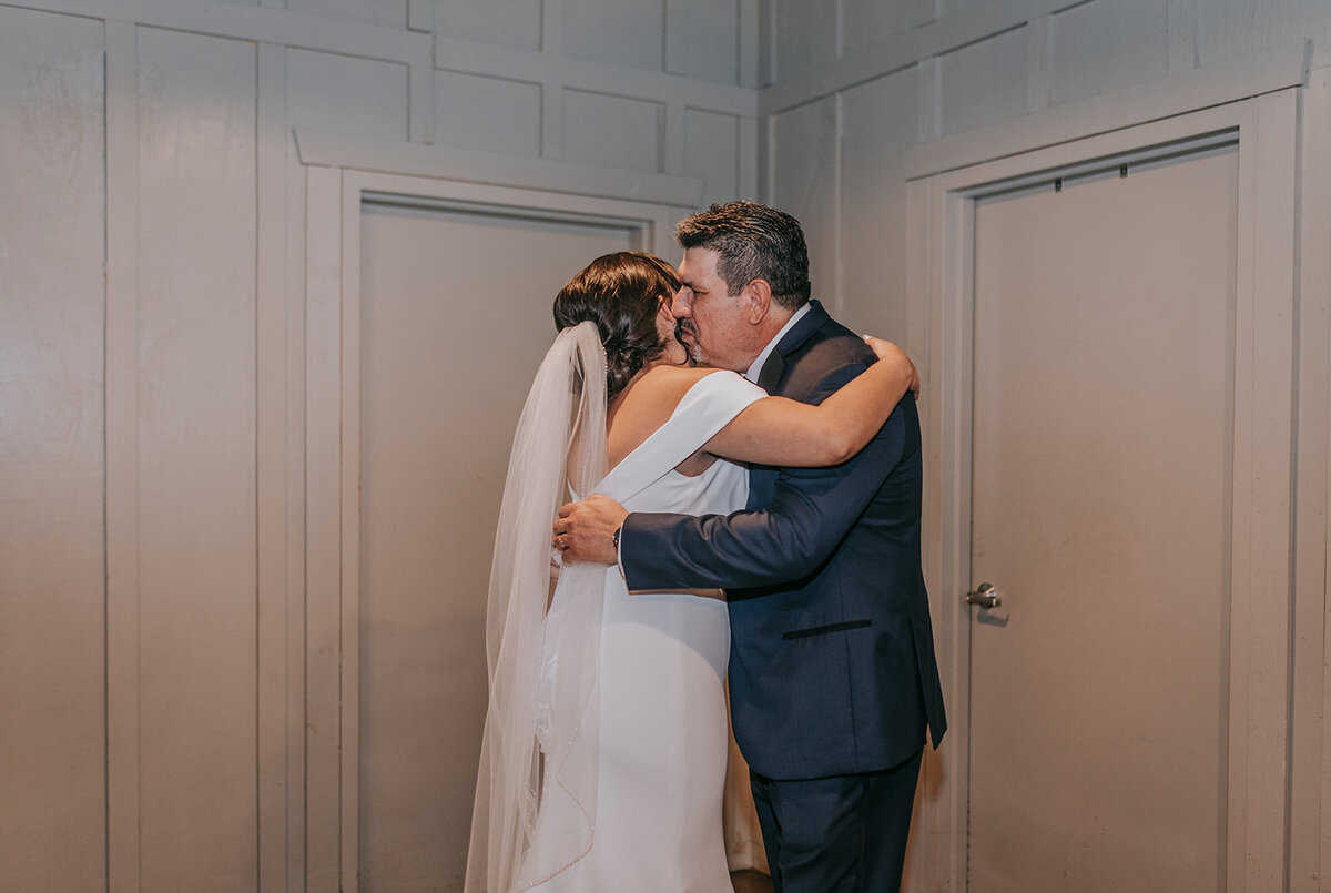 Photo of bride hugging her dad