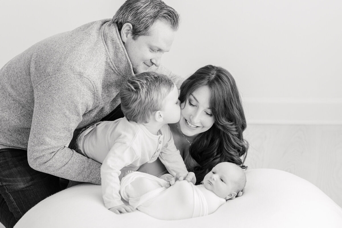 image of family of four  taken by boston newborn photographer