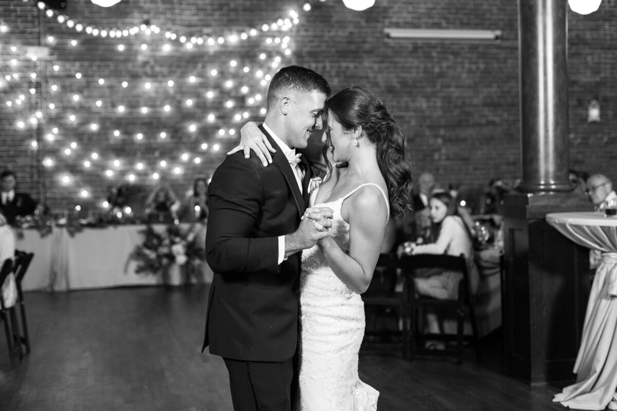 Bride and groom share first dance. 
