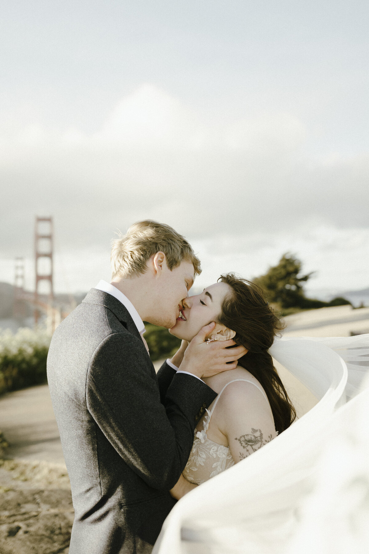 Bride and Groom at Marshall's Beach in San Francisco, California at sunset