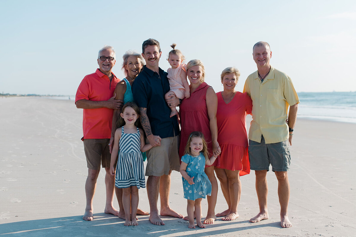 extended family back together again after a long deployment posing for photos in mayport florida