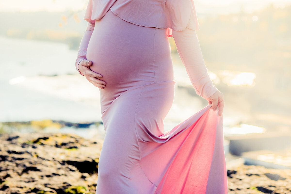 pregnant belly in pink dress