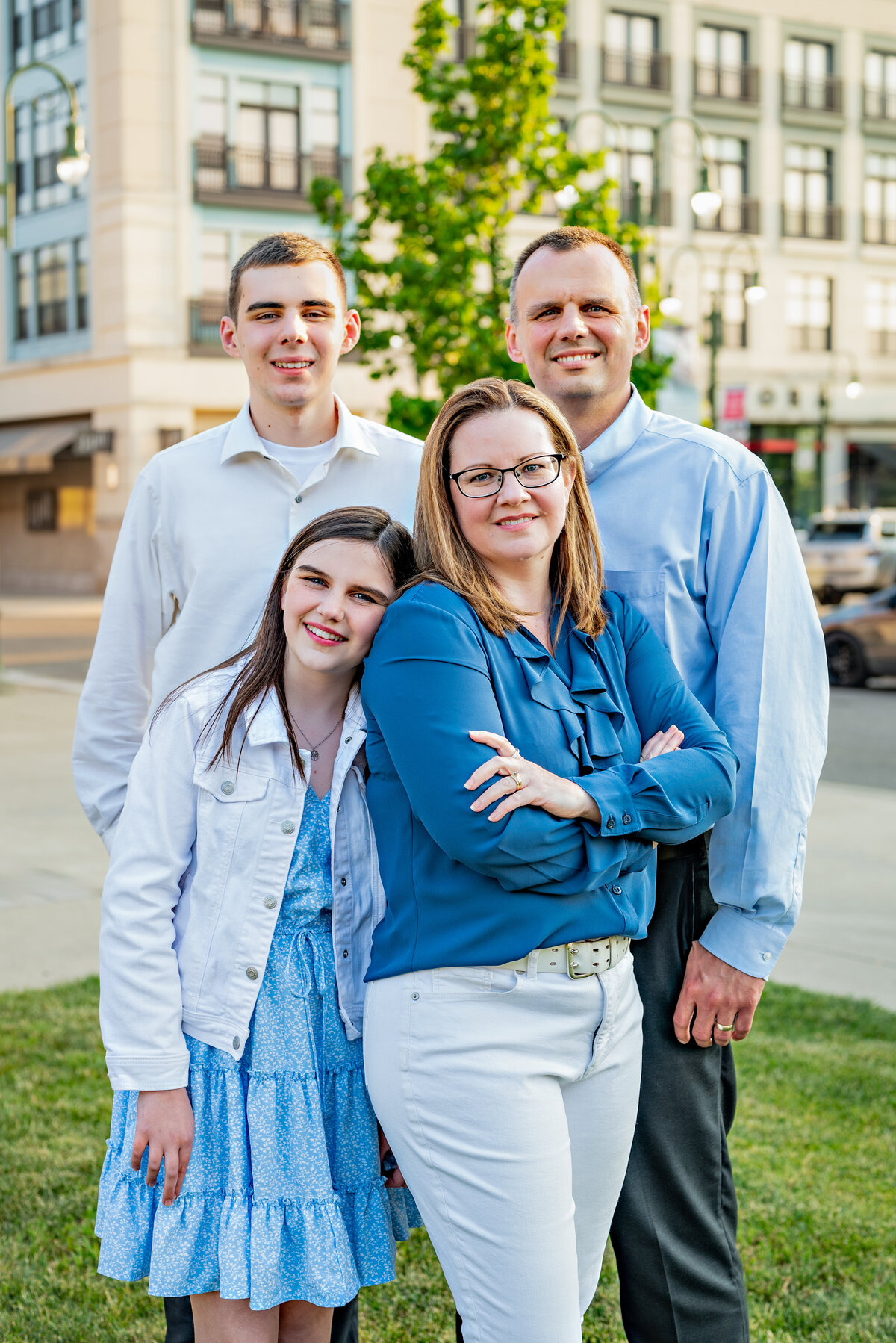 A family of four pose together for family pictures  in downtown Huntsville Alabama