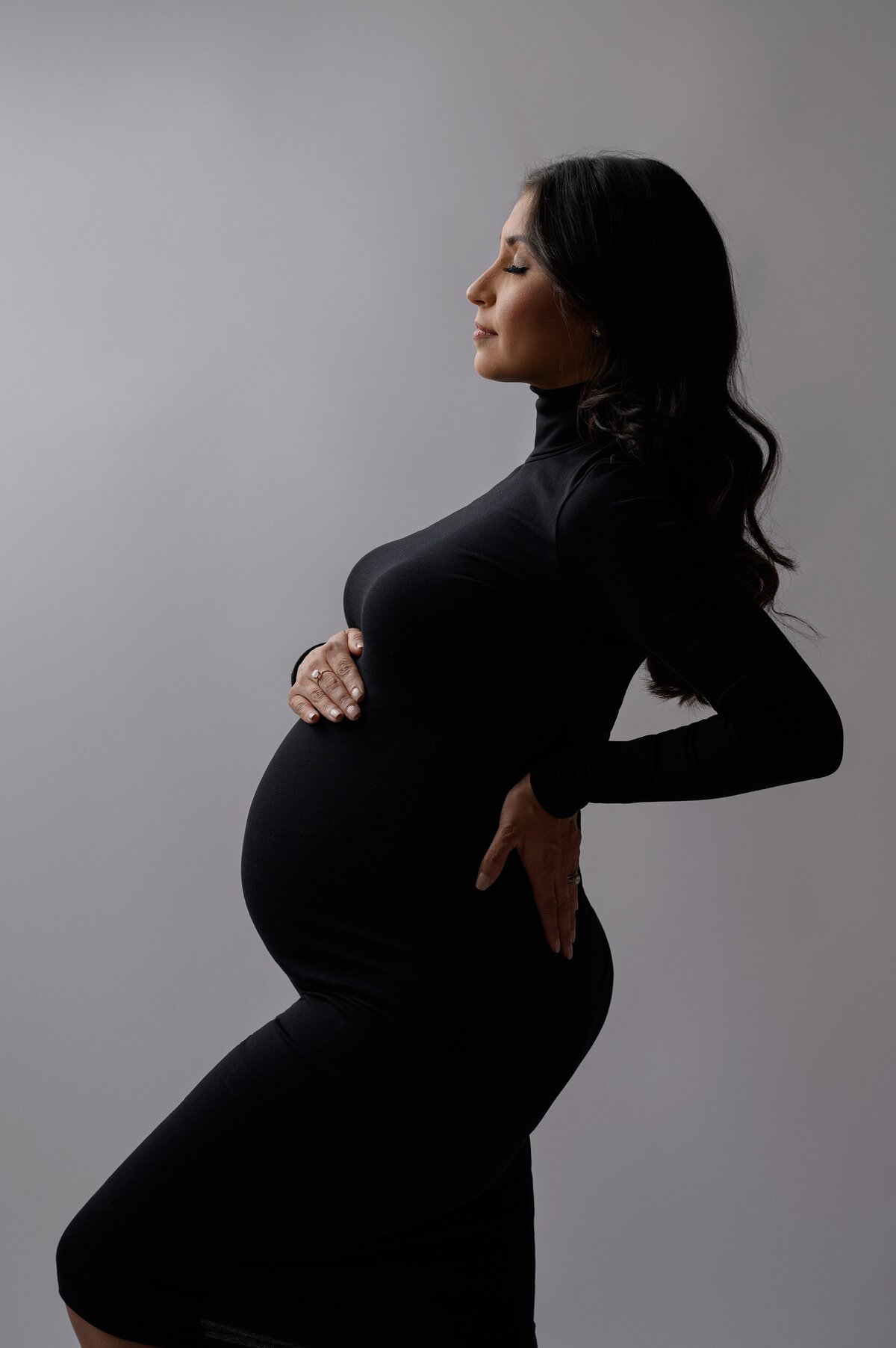 Black dress silhouette fine art maternity photoshoot in South Florida.