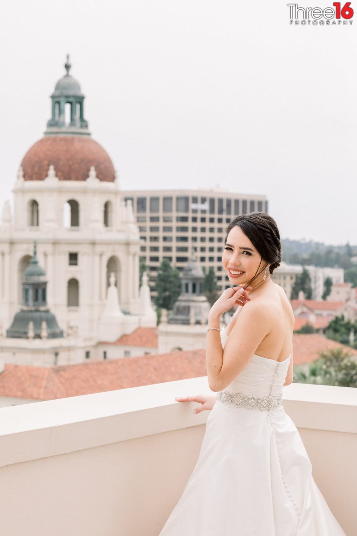 Beautiful Bride on the balcony looking out over the City of Pasadena