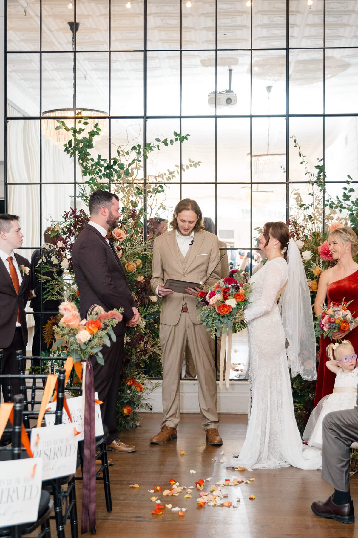 Bride and Groom during their wedding ceremony at The Old Metropolitan Hall in Charlottesville, Virginia.