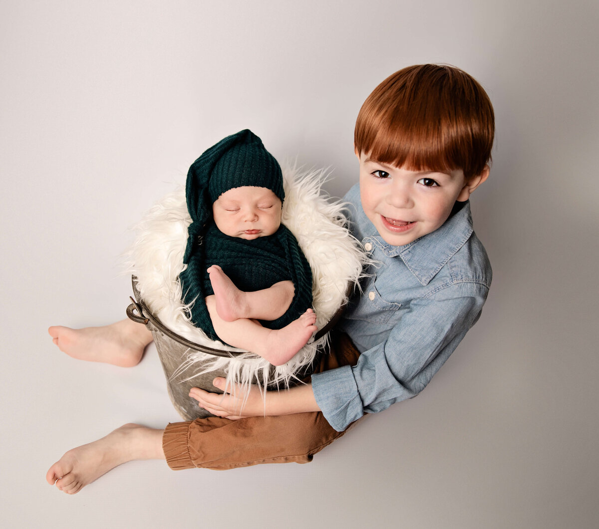 Portrait of newborn and his big brother in an Erie Pa photography studio