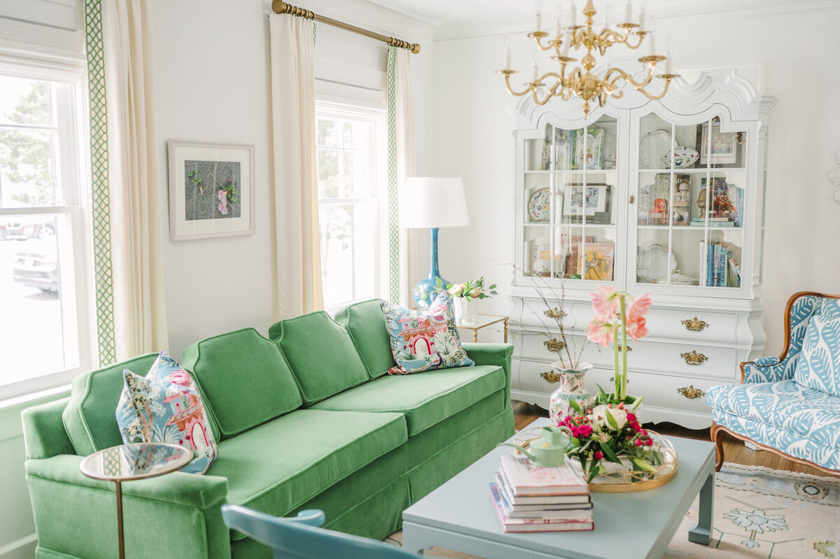 parlor with a green pink and blue color scheme