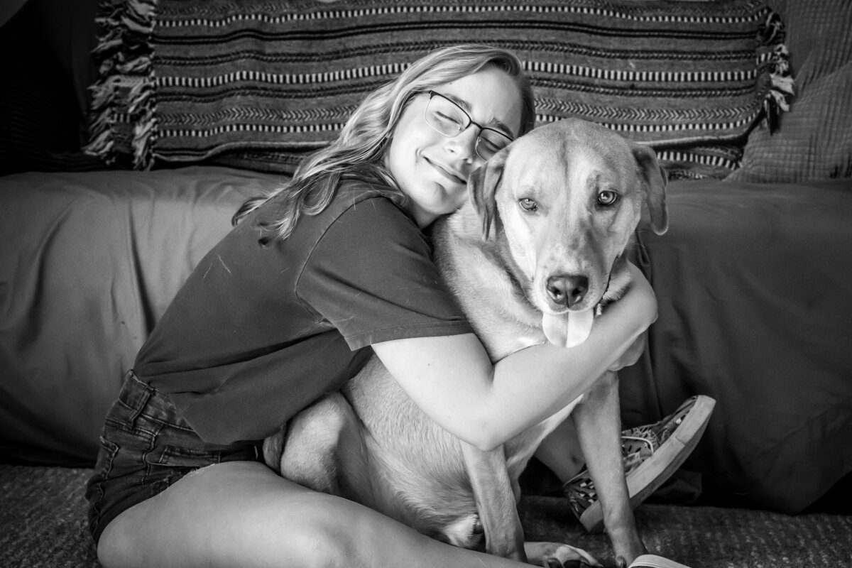 Rachel Chestnut hugs her dog, Charlie at her home in Gahanna, Ohio.