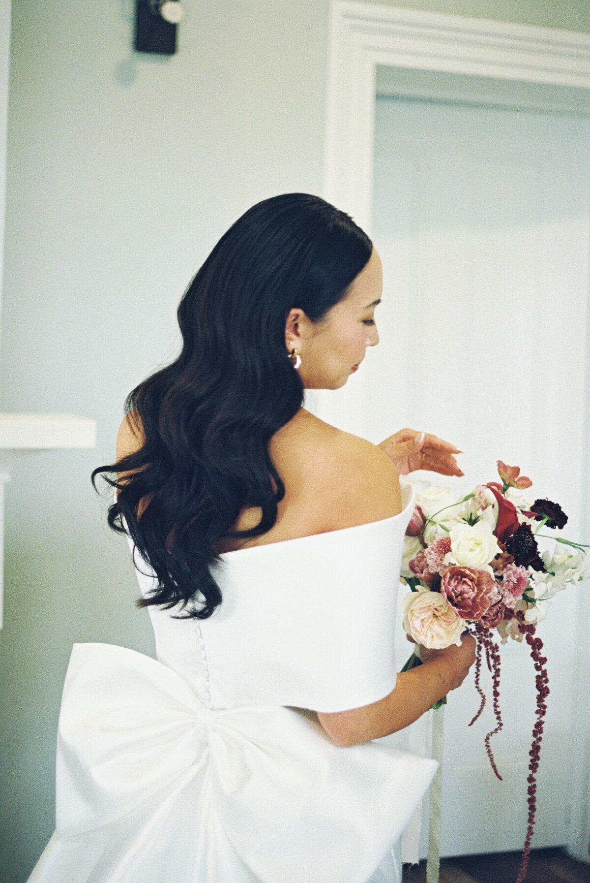 film photography of bride in her dress getting ready at the barton house