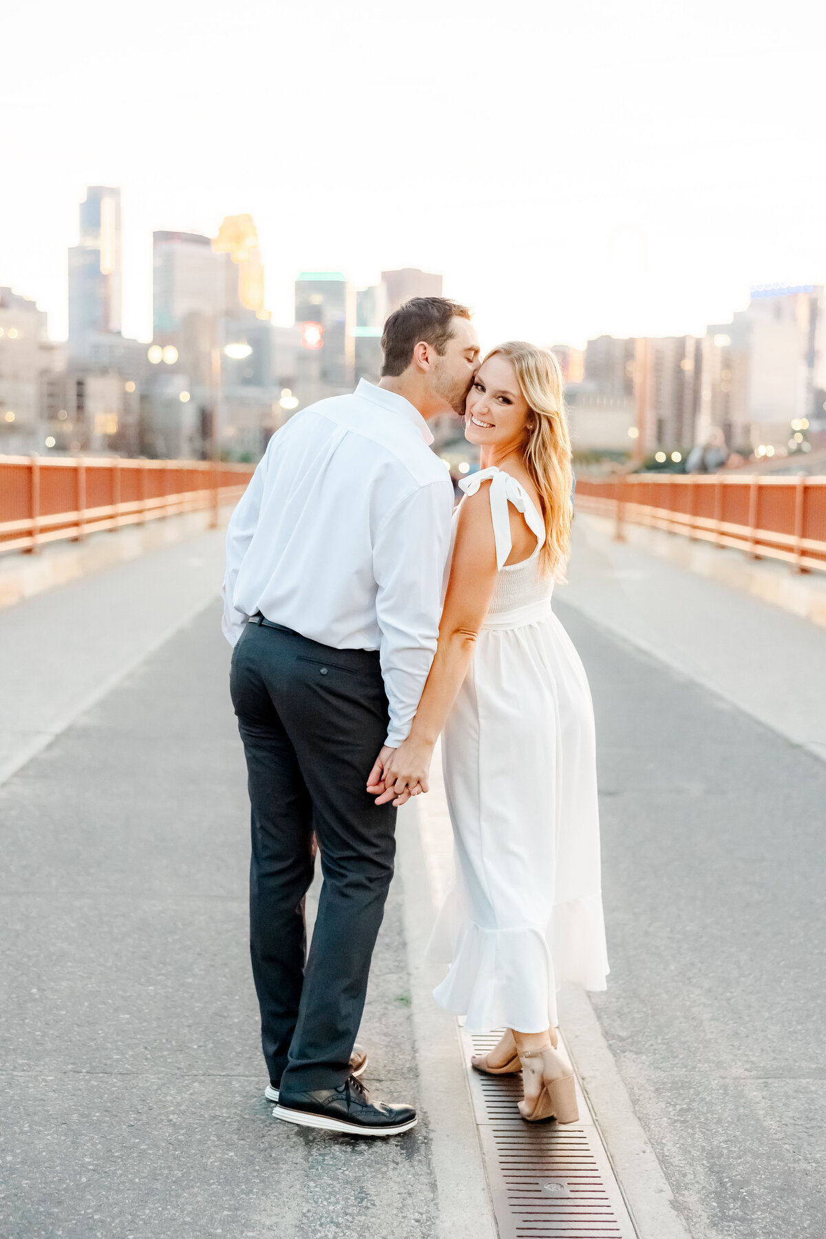 tampa wedding photography  of a couple kissing on a bridge