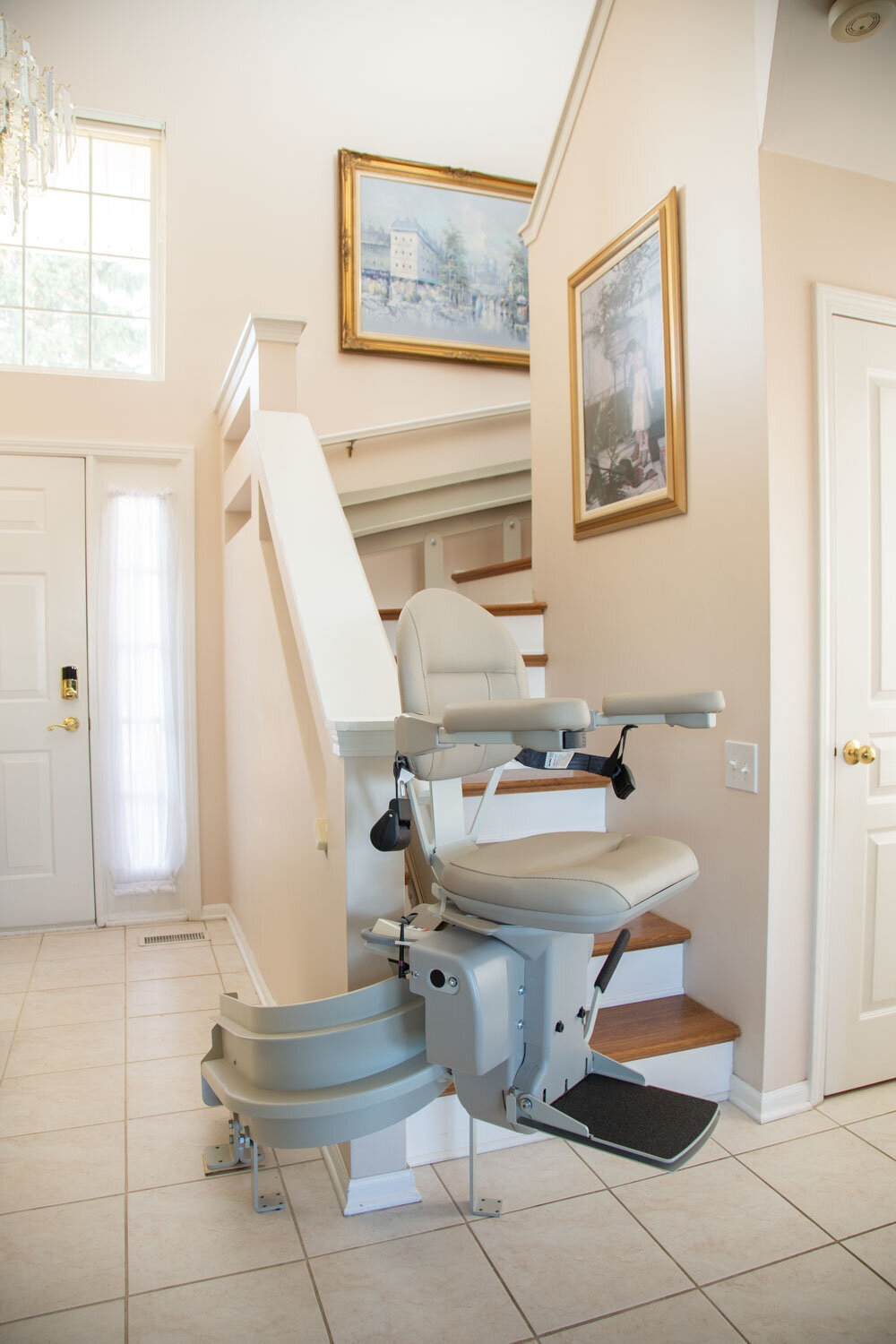 A stair lift with a picture on the wall above it