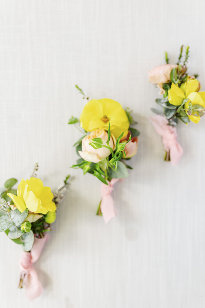 floral arrangements with yellow and pink flowers