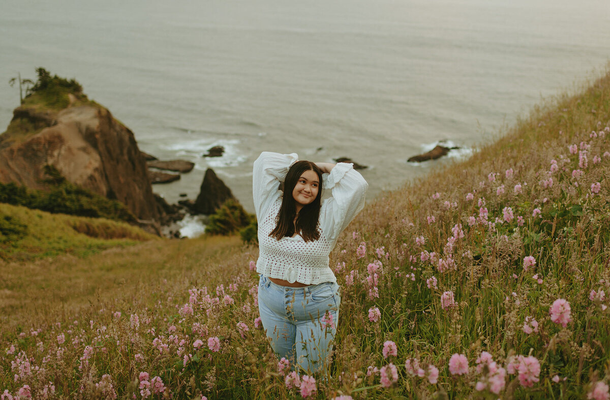 girl posing in a flower field along the Oregon coast