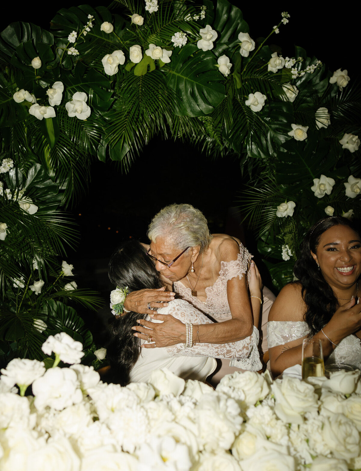 grandmother and bride photo, hugs at wedding reception, Playa del Carmen, Mexico