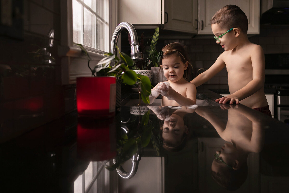NJ family photography of little kids playing in sink