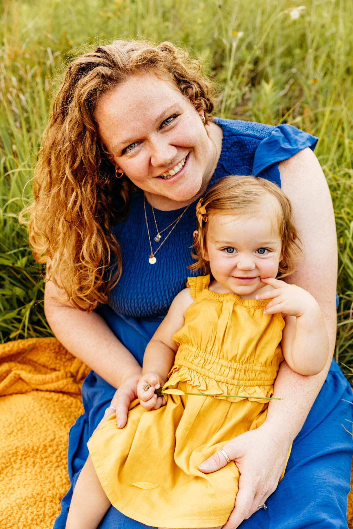 gorgeous mama holding her one year old for family photo session