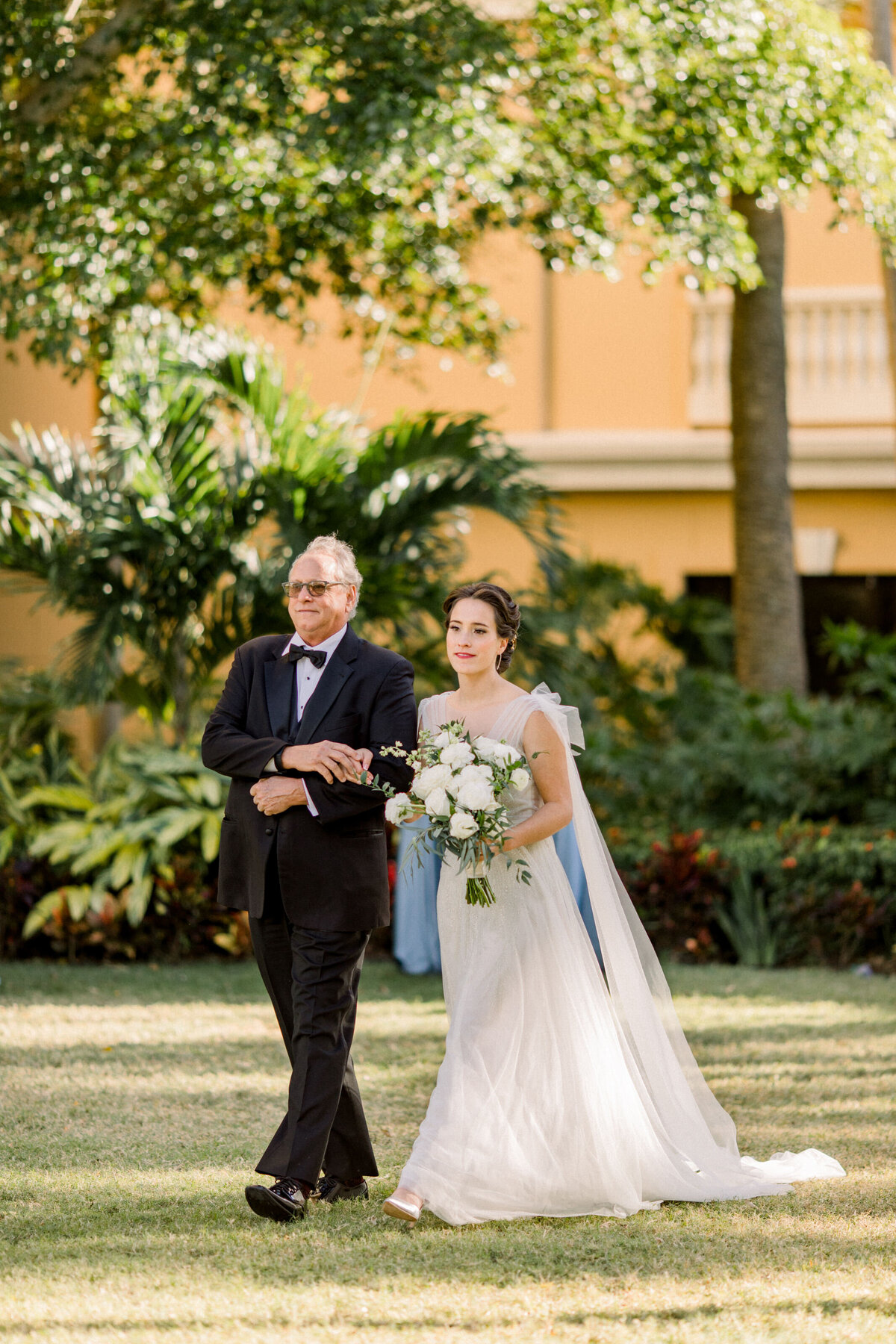 A bride walks into her Sarasota Ritz Carlton Wedding